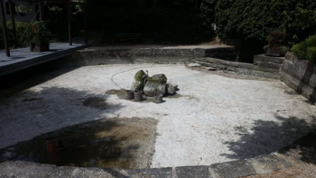 a large concrete lined pond